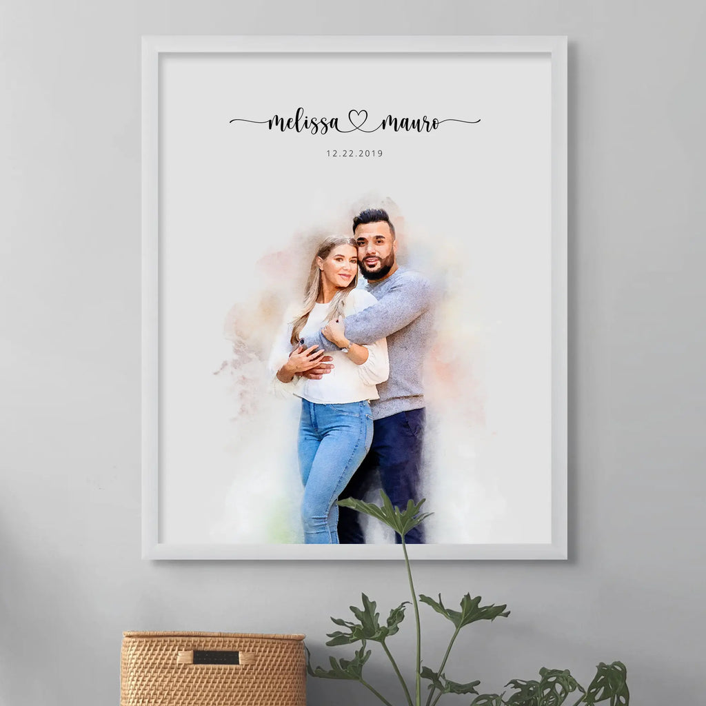 Watercolor-style portrait of a couple embracing, in a white frame above a woven basket and a plant