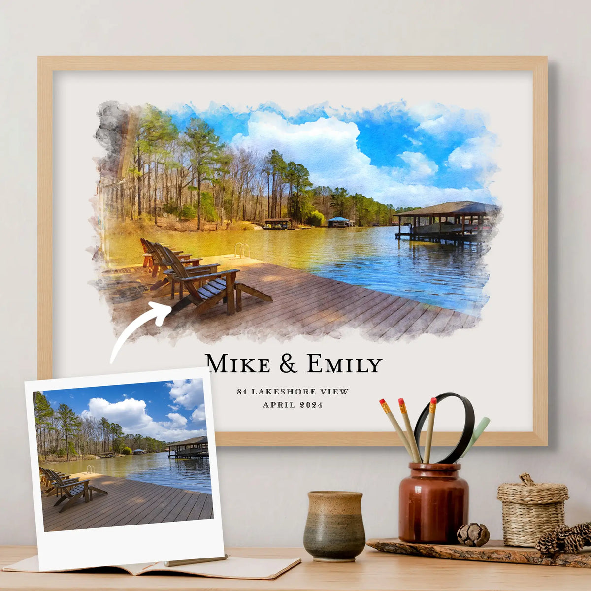 A snapshot of a lake dock with wooden chairs, beside its watercolor-style portrait in a light oak frame with names beneath